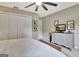 Cozy bedroom featuring a large closet, dresser with a TV, and neutral decor at 676 Mcbride Rd, Fayetteville, GA 30215