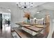 Open-concept dining room with a chandelier and view to the living room at 676 Mcbride Rd, Fayetteville, GA 30215