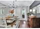 Charming dining area features a long wooden table with bench seating at 676 Mcbride Rd, Fayetteville, GA 30215