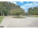 Long circular driveway lined with mature trees and lush landscaping. Ample space for vehicles and guest parking at 676 Mcbride Rd, Fayetteville, GA 30215