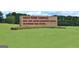 The Goza Road Complex entrance sign features nicely cut grass at 676 Mcbride Rd, Fayetteville, GA 30215