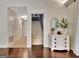 Bright foyer with hardwood floors, a decorative chest, and an entry to the staircase at 676 Mcbride Rd, Fayetteville, GA 30215