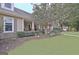 Charming front porch with rocking chairs, stone accents, and manicured landscaping leading to the front door at 676 Mcbride Rd, Fayetteville, GA 30215
