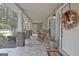 Spacious front porch with multiple rocking chairs, perfect for enjoying the outdoors at 676 Mcbride Rd, Fayetteville, GA 30215