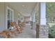 Extended front porch provides ample space for rocking chairs and outdoor decor at 676 Mcbride Rd, Fayetteville, GA 30215