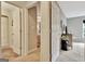 Neutral hallway with doors leading to a bathroom and bedroom, showcasing a well-lit and connected layout at 676 Mcbride Rd, Fayetteville, GA 30215