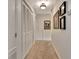 Hallway featuring a neutral carpet, painted walls, and decorative framed artwork at 676 Mcbride Rd, Fayetteville, GA 30215