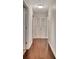 Hallway with hardwood flooring and white trim details exudes elegance and charm at 676 Mcbride Rd, Fayetteville, GA 30215