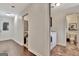 Hallway with access to the laundry room and powder room, leading to other living spaces at 676 Mcbride Rd, Fayetteville, GA 30215