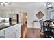 Bright kitchen featuring a bay window, white cabinets, and access to the eat-in dining at 676 Mcbride Rd, Fayetteville, GA 30215