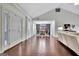 Hardwood floors flow through this living room showcasing the open floor plan to the dining area at 676 Mcbride Rd, Fayetteville, GA 30215