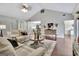 Inviting living room features vaulted ceilings, hardwood floors, and a cozy fireplace at 676 Mcbride Rd, Fayetteville, GA 30215