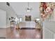 Bright living room with hardwood floors, stone fireplace, and vaulted ceiling at 676 Mcbride Rd, Fayetteville, GA 30215