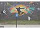 Exterior wall with colorful mural and handicapped parking sign at 676 Mcbride Rd, Fayetteville, GA 30215
