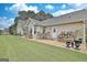 Back patio featuring an outdoor dining set, ideal for entertaining and relaxing at 676 Mcbride Rd, Fayetteville, GA 30215