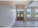Bright foyer with double doors, gleaming hardwood floors, and large windows offering natural light at 4080 Whitney Rd, Social Circle, GA 30025