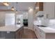 Modern kitchen with white cabinets, a large center island, and stainless steel appliances at 4080 Whitney Rd, Social Circle, GA 30025