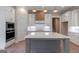 Stylish kitchen features white cabinetry, a center island with seating, and modern appliances at 4080 Whitney Rd, Social Circle, GA 30025