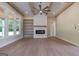 Spacious living room featuring a cozy fireplace, custom built-ins, and plenty of natural light at 4080 Whitney Rd, Social Circle, GA 30025