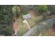 Aerial view of property showing home, yard, driveway, and surrounding mature trees at 1910 Reese Rd, Rutledge, GA 30663