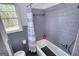 Functional bathroom with a shower/tub, toilet, and window for ventilation at 1910 Reese Rd, Rutledge, GA 30663