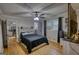 Spacious bedroom with hardwood floors, ceiling fan, and a view to the kitchen and bathroom at 1910 Reese Rd, Rutledge, GA 30663