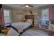 Charming bedroom with a comfortable bed and plenty of natural light at 1910 Reese Rd, Rutledge, GA 30663