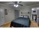 Bedroom featuring a wood headboard, access to the bathroom, and ample natural light at 1910 Reese Rd, Rutledge, GA 30663
