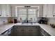 A kitchen featuring granite countertops, gray cabinets, and abundant natural light at 1910 Reese Rd, Rutledge, GA 30663