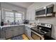A kitchen featuring stainless steel appliances, granite countertops, and ample natural light at 1910 Reese Rd, Rutledge, GA 30663