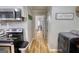 Hallway features modern laundry appliances and leads to additional rooms in the home at 1910 Reese Rd, Rutledge, GA 30663