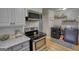 A laundry area with appliances, storage, decor and a window for natural light at 1910 Reese Rd, Rutledge, GA 30663