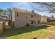 The home features a fenced backyard with a patio and ample green space at 4180 Pineset Dr, Alpharetta, GA 30022