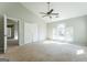 Carpeted bedroom with ceiling fan, vaulted ceiling, and closet with double doors at 4180 Pineset Dr, Alpharetta, GA 30022