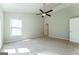 Carpeted bedroom with ceiling fan and window at 4180 Pineset Dr, Alpharetta, GA 30022