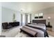Modern bedroom featuring a luxe gray color scheme, plush rug, and stylish accent furniture at 4180 Pineset Dr, Alpharetta, GA 30022