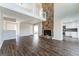 Spacious living room with a stone fireplace, hardwood floors, and loft overlook at 4180 Pineset Dr, Alpharetta, GA 30022