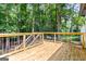 A wooden deck overlooking wooded backyard; ideal for outdoor living and entertaining at 2145 Venesa Cir, Austell, GA 30168