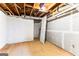 Spacious unfinished basement area with concrete walls, exposed ceiling and a sturdy open door at 2145 Venesa Cir, Austell, GA 30168