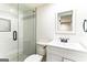 Bathroom features glass-door shower with hexagon and subway tile, modern fixtures and vanity at 2145 Venesa Cir, Austell, GA 30168