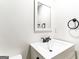 Bathroom featuring white vanity, modern fixtures and mirror at 2145 Venesa Cir, Austell, GA 30168