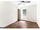 Bedroom featuring hardwood floors, natural light and open closet at 2145 Venesa Cir, Austell, GA 30168