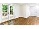 Bedroom with hardwood floors and glass paneled doors to deck at 2145 Venesa Cir, Austell, GA 30168