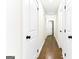 Hallway with hardwood floors and white doors at 2145 Venesa Cir, Austell, GA 30168