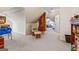 Finished attic space with comfortable seating, including a rocking chair and ottoman, and exposed brick column at 2173 Conyers Se St, Covington, GA 30014