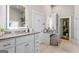 Bathroom with a double vanity, and a walk-in closet creates a bright and functional space at 2173 Conyers Se St, Covington, GA 30014