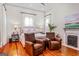 Serene main bedroom with hardwood floors, fireplace, and neutral décor, creating a relaxing atmosphere at 2173 Conyers Se St, Covington, GA 30014
