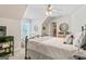 Comfortable bedroom with soft, neutral colors, a sitting area, and lots of natural light at 2173 Conyers Se St, Covington, GA 30014