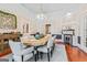 Elegant dining area showcasing a hardwood table, light gray chairs, and decorative wallpaper at 2173 Conyers Se St, Covington, GA 30014