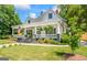 Beautiful front yard with a lush green lawn and landscaped garden beds leading up to the inviting front porch at 2173 Conyers Se St, Covington, GA 30014